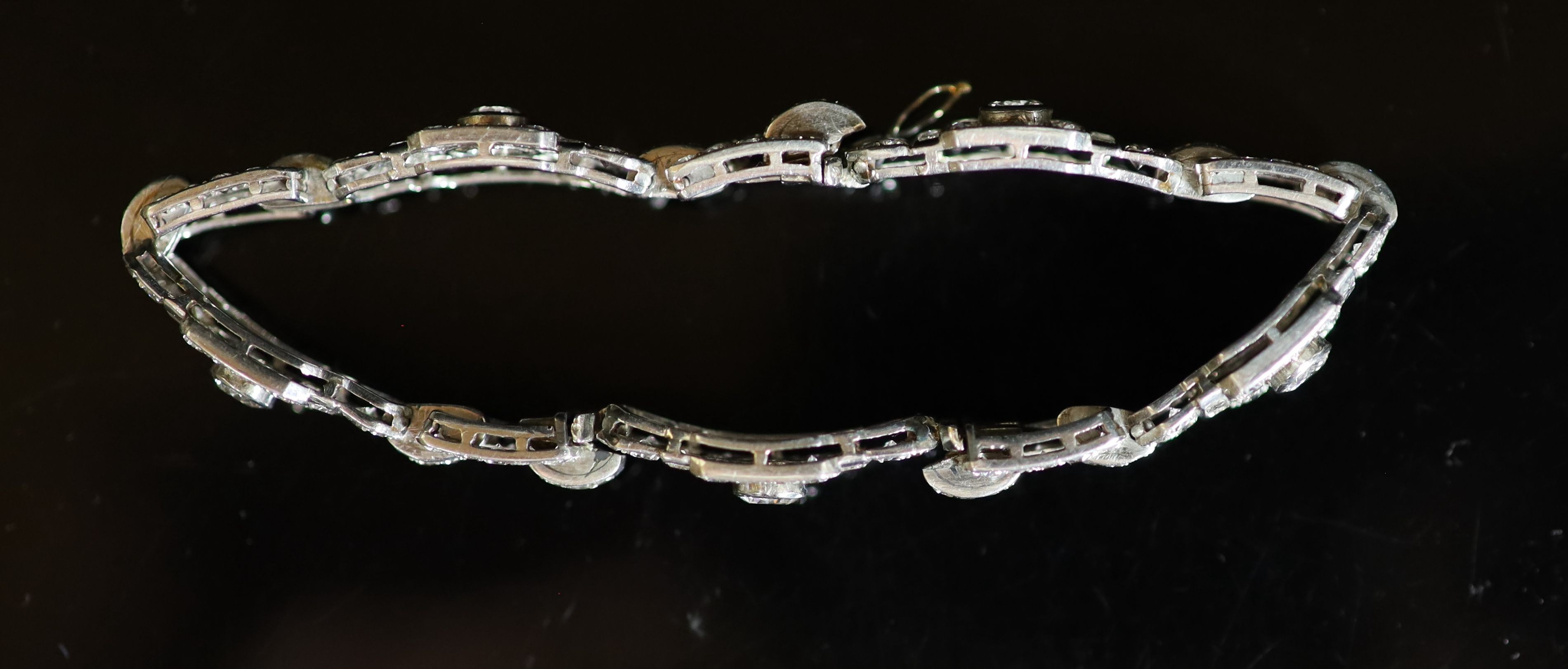 A mid 20th century platinum and diamond encrusted rectangular link bracelet